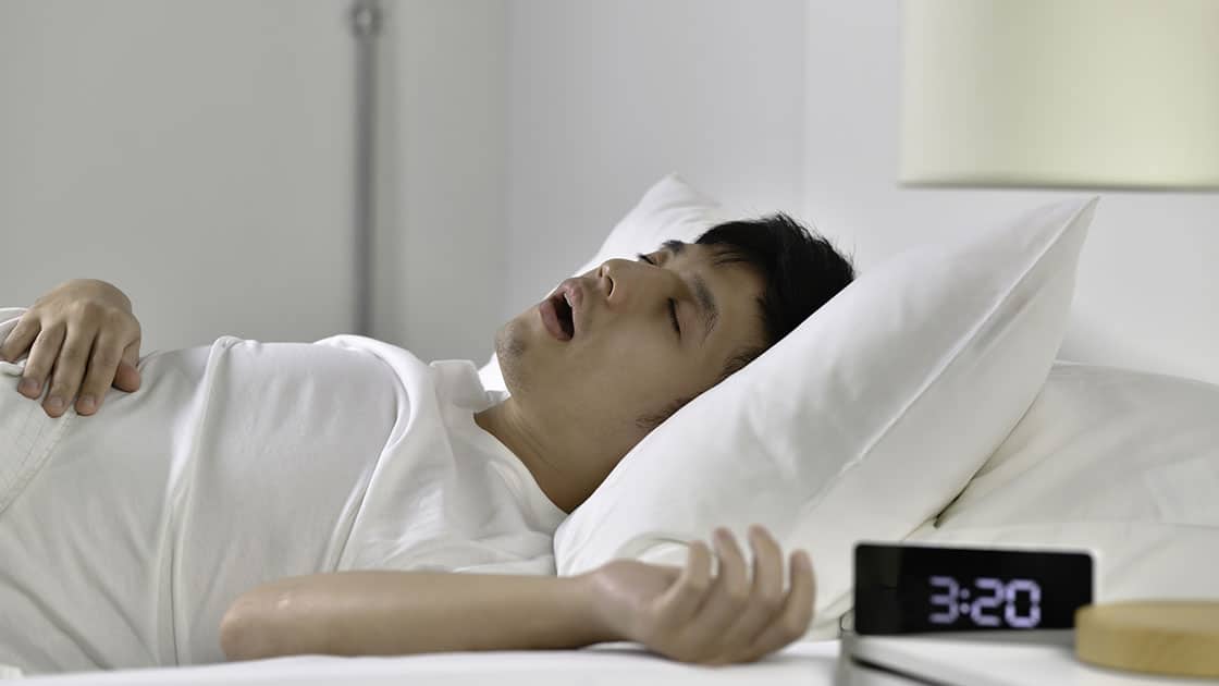 Man having trouble sleeping